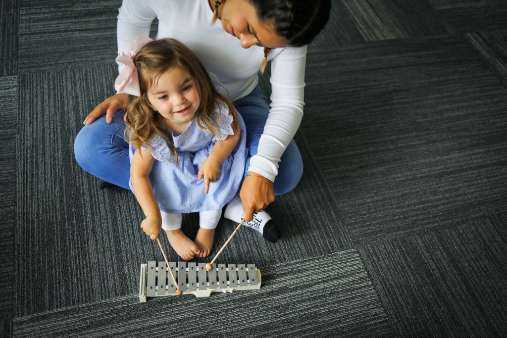 little girl with mom - xylophone